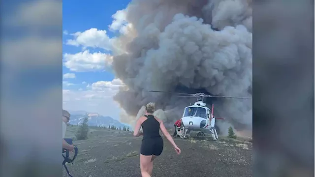 Hikers credit helicopter tour company with saving them from raging B.C. wildfire