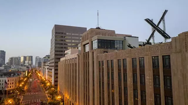 A flashing 'X' was installed atop the San Francisco headquarters following Twitter's rebrand. A city complaint says the sign went up without a permit | CNN Business