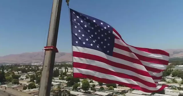 San Jose crane business flies 1,800 square foot American flag for 4th to honor Vietnam vet