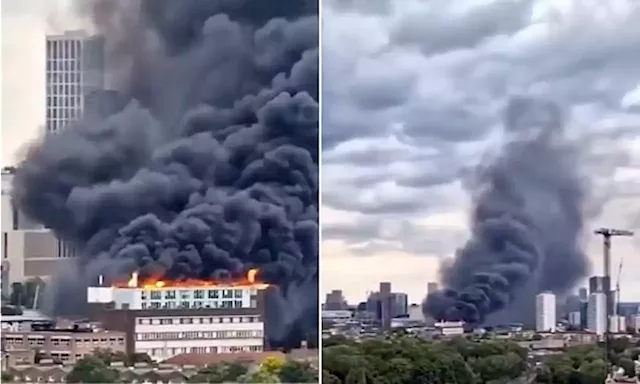 Huge fire breaks out in flats on top of business centre in London