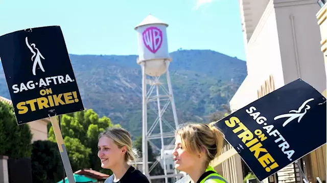 Warner Bros. Discovery warns Hollywood strikes could hurt business