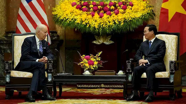 Biden highlights business deals and pays respects at John McCain memorial to wrap up Vietnam visit