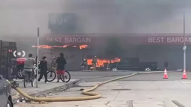 ‘Here we are again.' Fire at South Central business forces nearby residents out of their homes