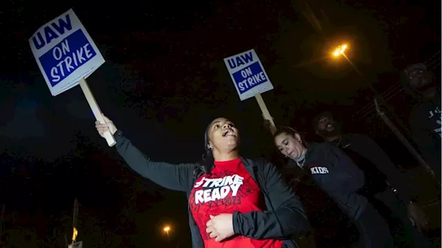 Workers strike at all 3 Detroit automakers, a new tactic to squeeze companies for better pay