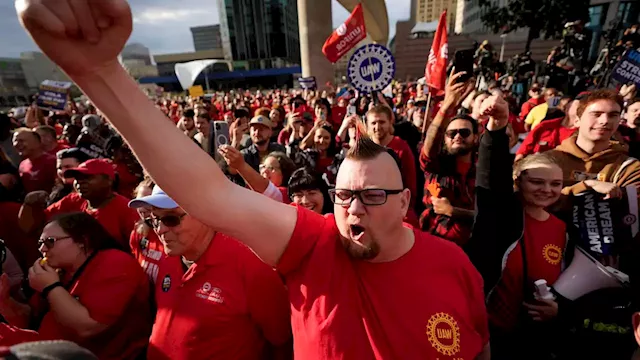 Workers strike at all 3 Detroit automakers, a new tactic to squeeze companies for better pay