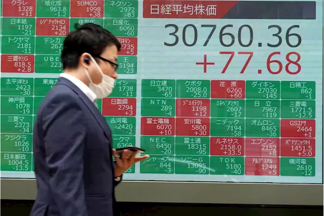 Asian stocks mixed as investors grapple with higher rates