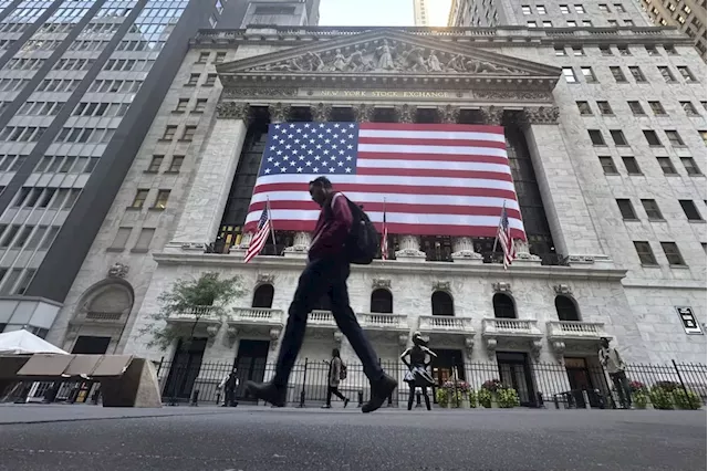 Stock market today: Wall Street holds near record levels and banks rise