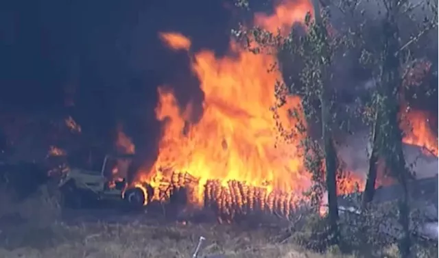 Firefighters contain large fire at pallet making business in East Houston