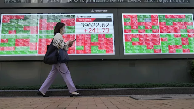 Stock market today: Asian shares are mostly higher after Wall St powers to more records