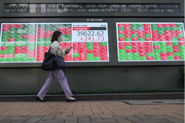 Stock market today: Asian shares are mixed after Wall St powers to more records