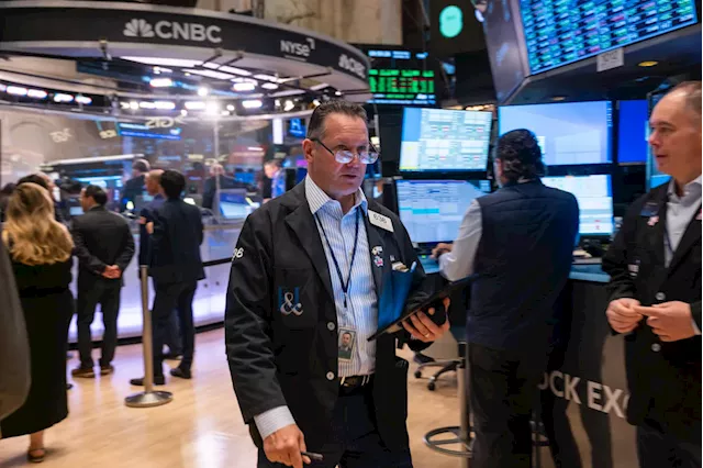 Stock market today: Dow, S&P 500 slip, Nasdaq wavers with flood of earnings ahead