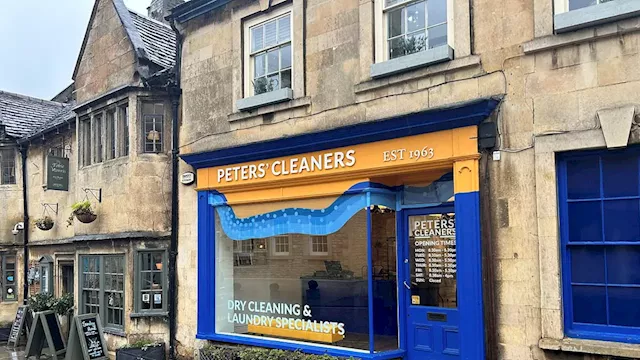 Owner of bright orange and blue dry cleaners' store in 'most picturesque' market town is told to...