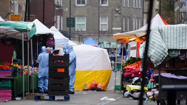 One killed and two injured after stabbing at south London market