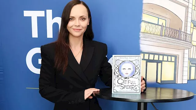 Christina Ricci oozes business chic in blazer dress at book signing for new tarot deck and guidebook...