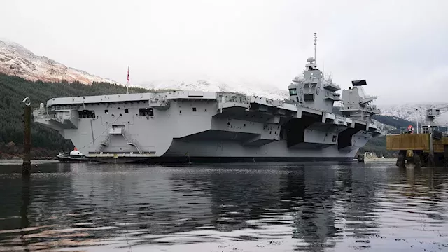 Royal Navy's £3.2billion aircraft carrier stocks up on ammunition and 'increases readiness' as...