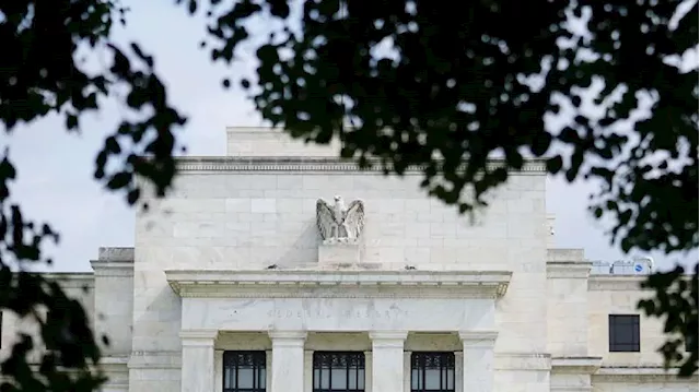 Fed cuts rates, notes labor market easing and solid economic growth