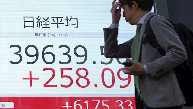 Stock market today: Asian shares gain after US Fed cuts interest rates