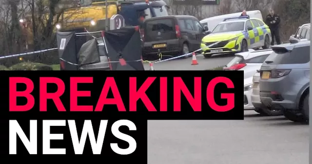 Two Women Arrested After Man's Body Found in Car at Business Park