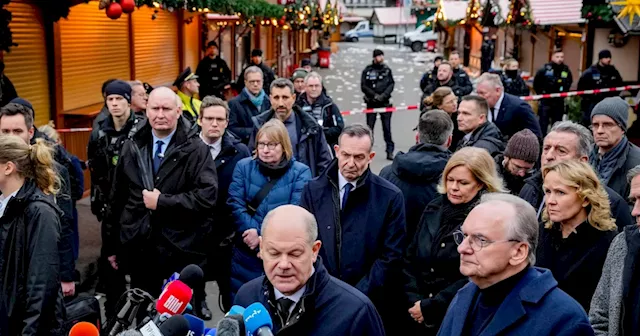 Germans mourn the 5 killed and 200 injured in the apparent attack on a Christmas market