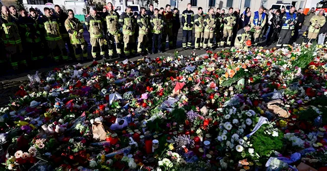 Flowers, candles and a deathly silence at Magdeburg Christmas market