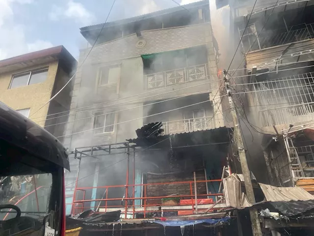 Goods destroyed as fire razes three buildings in Lagos market