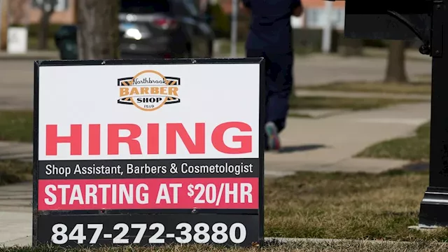 Applications for US unemployment benefits dip to 210,000 in strong job market