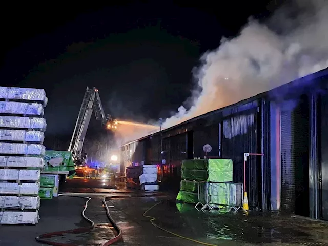 Crews spend all night battling blaze at construction company HQ