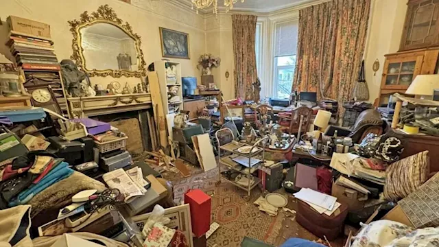 'Hoarder's house' on the Isle of Wight crammed with decades of junk goes on the market for £400,000...