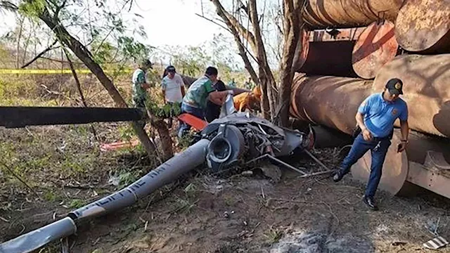 2 Philippine navy pilots killed after a training helicopter crashes near a public market and homes