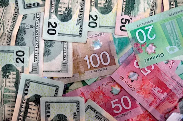 Canadian Dollar trims losses as a more positive market mood hurts the USD