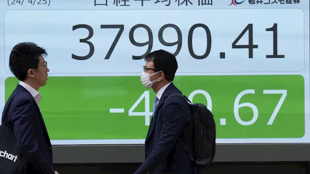 Stock market today: Asian benchmarks mostly slide as investors focus on earnings