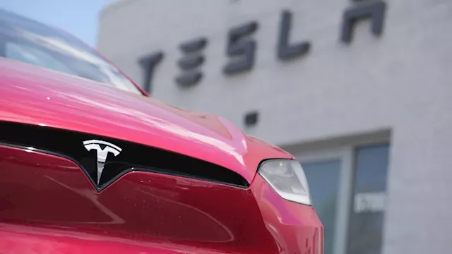 Tesla's stock leaps on reports of Chinese approval for the company's driving software