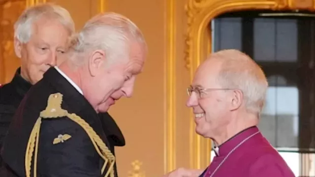 Smiling King Charles shows he's truly back to business with first investiture ceremony at Windsor...