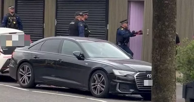 Moment police burst door of Manchester business during raid