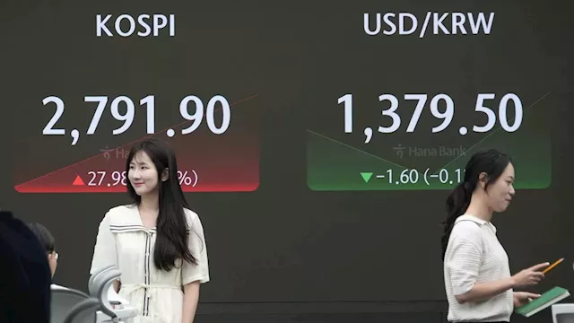 Stock market today: Asian stocks are mixed after Wall Street edges to more records