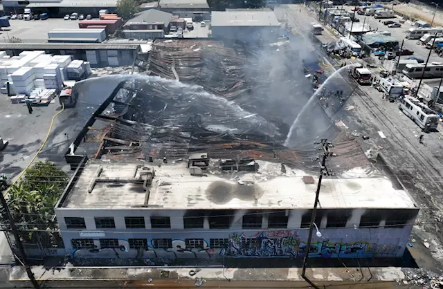 Three-alarm fire torches West Oakland roofing supply business