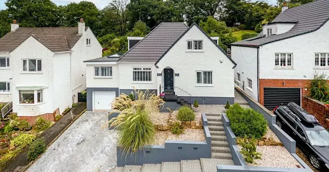 Bearsden home with beautiful tiered garden and summer house hits the market