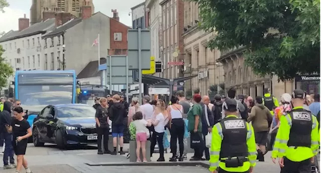 Small-scale protest as heated exchanges between two groups on Preston Flag Market