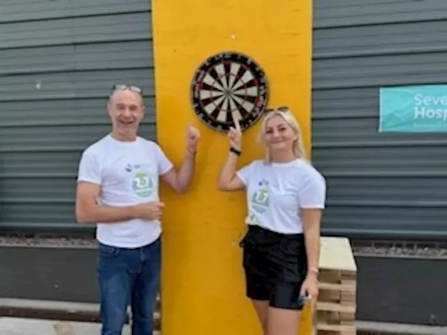 Shropshire business hits the bullseye at darts marathon for Severn Hospice