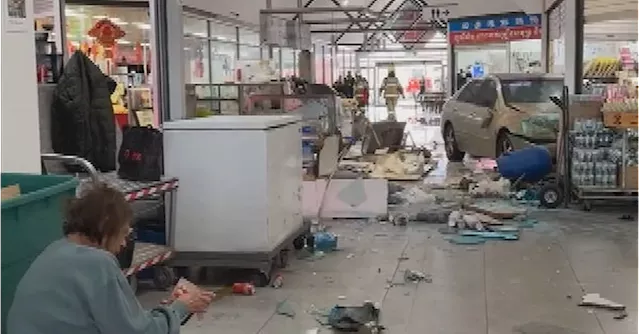 Business owner, customer injured after car ploughs into shopping centre