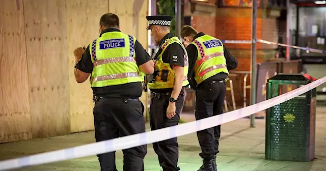 Blood splattered pavement as police hunt attacker and 'machete' after horror market stabbing