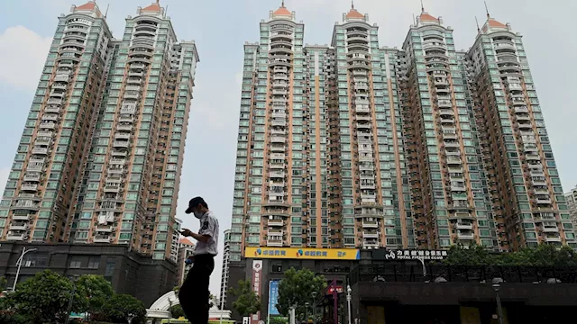 Chinese Cities Ease Home Purchase Restrictions to Boost Market